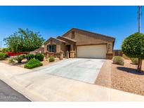 One story home with attached garage and landscaping at 20051 N Herbert Ave, Maricopa, AZ 85138