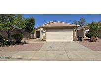 Single-story home with a one-car garage and desert landscaping at 12413 N El Frio St, El Mirage, AZ 85335