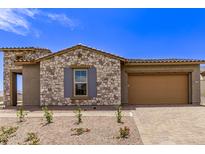 Charming house exterior with stone and stucco finishes at 20755 W San Miguel Ave, Buckeye, AZ 85396