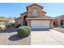 Two-story home with attached garage and well-maintained landscaping at 17511 N Kimberly Way, Surprise, AZ 85374