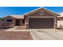 Cute one-story home with a two-car garage and well-maintained landscaping at 16194 W Jefferson St, Goodyear, AZ 85338