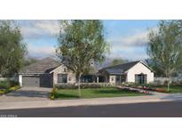 Modern farmhouse style home with attached garage and landscaping at 7532 E Laredo Ln, Scottsdale, AZ 85250