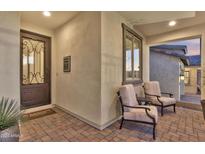 Welcoming front entry with decorative door and seating at 3642 E Roland St, Mesa, AZ 85215