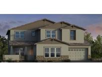 Two-story home with stone accents, large windows, and a two car garage at 5727 N 84Th Dr, Glendale, AZ 85305