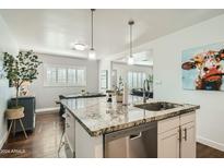 Modern kitchen with granite island and stainless steel appliances at 1408 W 7Th St, Tempe, AZ 85281