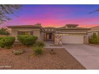 One-story home with a two-car garage and desert landscaping at 13820 W Cheery Lynn Rd, Avondale, AZ 85392