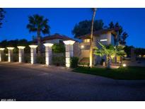 Attractive community entrance with illuminated pillars at 10015 E Mountain View Rd # 2011, Scottsdale, AZ 85258
