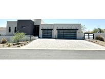 Modern home exterior with two-car garage at 27222 N 64Th Dr, Phoenix, AZ 85083
