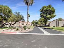 Attractive community entrance with landscaping and parking at 7417 N Via Camello Del Norte -- # 160, Scottsdale, AZ 85258