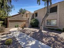 Attractive exterior of a two-story condo with a walkway and landscaping at 7417 N Via Camello Del Norte -- # 160, Scottsdale, AZ 85258