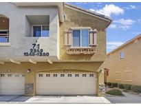 Modern condo building with attached garage and street address at 2150 W Alameda Rd # 1250, Phoenix, AZ 85085