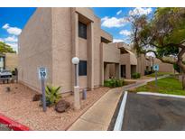 Building exterior showcasing landscaping and parking at 1920 W Lindner Ave # 234, Mesa, AZ 85202