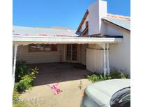 Carport and entrance to a home undergoing renovations at 1018 W Rio Salado Pkwy, Mesa, AZ 85201