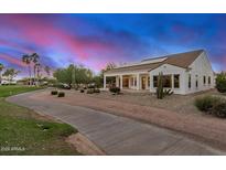 Single-story home with a golf course view and solar panels at 16401 W Monterey Way, Goodyear, AZ 85395