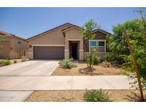 Modern single-story home with two-car garage and landscaping at 17821 W Villa Hermosa Ln, Surprise, AZ 85387