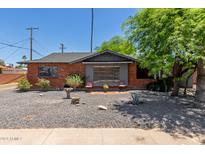 Brick ranch home with front yard landscaping at 6609 N 41St Dr, Phoenix, AZ 85019