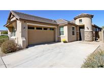 House exterior view, featuring a two-car garage and stone accents at 2834 E Fraktur Rd, Phoenix, AZ 85040