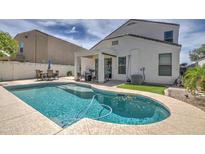 Inviting kidney-shaped pool in a well-maintained backyard setting at 3882 W Alabama Ln, San Tan Valley, AZ 85144