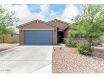 Modern house exterior with gray garage door at 4455 W Suncup Dr, San Tan Valley, AZ 85144