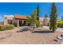 Spanish style home with a tile roof and nicely landscaped yard at 14602 N Olympic Way, Fountain Hills, AZ 85268