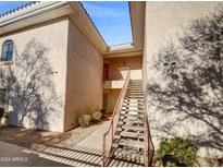 Exterior view of a building showing stairs leading to an entrance at 10030 W Indian School Rd # 257, Phoenix, AZ 85037