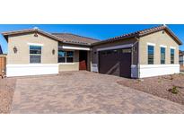 One-story home with a brown garage door, a paved driveway, and desert landscaping at 16348 W Avenida Del Sol --, Surprise, AZ 85387