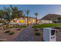 Stunning home exterior with a beautifully landscaped yard at 4723 E Desert Park Pl, Paradise Valley, AZ 85253