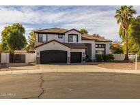 Two-story home with a three-car garage and landscaped front yard at 4467 E Kelly Ct, Gilbert, AZ 85298