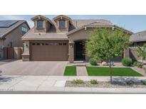 Beautiful two-story home with landscaped yard at 16062 W Alameda Rd, Surprise, AZ 85387