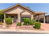 Charming single-story home with landscaping and driveway at 11411 N 91St Ave # 105, Peoria, AZ 85345