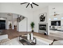 Spacious living room features a fireplace and hardwood floors at 12158 N 138Th St, Scottsdale, AZ 85259