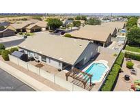 Aerial view showcasing home, pool, and surrounding neighborhood at 8762 E Posada Ave, Mesa, AZ 85212