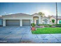 Two-story home with two car garage and landscaped yard at 772 N Swan Dr, Gilbert, AZ 85234