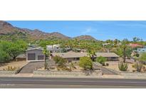 Luxury home with a large yard and mountain views at 4452 E Lincoln Dr, Paradise Valley, AZ 85253