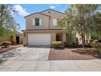 Two-story house with white garage door and landscaping at 2084 N 214Th Dr, Buckeye, AZ 85396