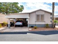 Single-story home with carport and desert landscaping at 17200 W Bell Rd # 1592, Surprise, AZ 85374