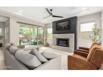 Spacious living room with fireplace and sliding glass doors at 20857 E Arrowhead Trl, Queen Creek, AZ 85142