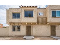 Front view of a tan duplex with two entrances at 4015 S 45Th St, Phoenix, AZ 85040