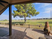 Covered patio overlooking a golf course at 650 N Hawes Rd # 4830, Mesa, AZ 85207