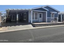 Nice curb appeal, covered parking, and welcoming front porch at 650 N Hawes Rd # 3404, Mesa, AZ 85207