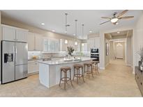 Modern kitchen with island and stainless steel appliances at 25807 N 19Th Gln, Phoenix, AZ 85085
