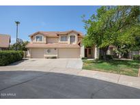 Two-story home with three-car garage and well-manicured lawn at 19422 N 67Th Ln, Glendale, AZ 85308