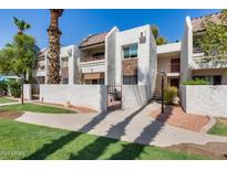 Spanish style condo building with walkway and landscaping at 7350 N Via Paseo Del Sur -- # N104, Scottsdale, AZ 85258