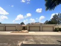 Front view of a townhome complex with attached garages at 2617 W Willow Ave, Phoenix, AZ 85029