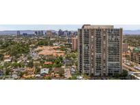 Aerial view of a highrise building in the city with mountain views in the background at 2323 N Central Ave # 1002, Phoenix, AZ 85004