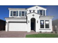 Two-story house with white exterior, gray shutters, and a landscaped lawn at 22794 E Stacey Rd, Queen Creek, AZ 85142