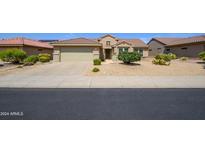 Single story home with attached garage and desert landscaping at 18000 N Estrella Vista Dr, Surprise, AZ 85374