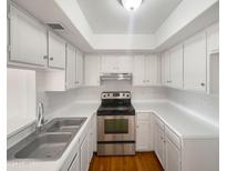 Clean and bright kitchen with white cabinets at 4730 W Northern Ave # 3067, Glendale, AZ 85301