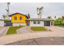 Mid-century modern home with landscaped yard at 8608 E Angus Dr, Scottsdale, AZ 85251