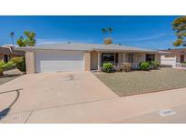 Ranch style home with a single-car garage and landscaping at 10342 W Talisman Rd, Sun City, AZ 85351